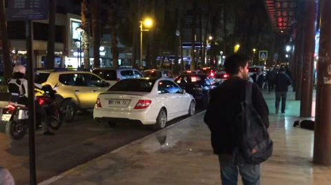 Antalya, Turkey - March 2016: a lively main street at night, people go, go cars Stock Footage 65190876