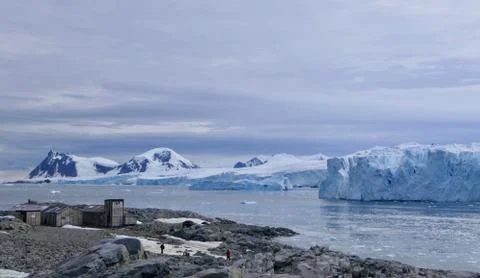Antarctic base e before glacier front with stone beach landscape in Antarctica Stock Photos