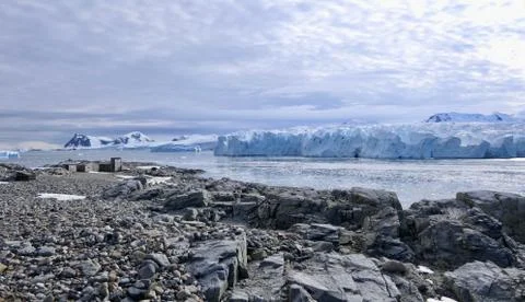 Antarctic base e before glacier front with stone beach landscape in Antarctica Stock Photos