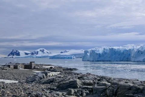 Antarctic base e before glacier front with stone beach landscape in Antarctica Stock Photos