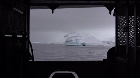 Antarctic expedition.  Exploring icebergs and sea views from a boat Stock Footage 333246308