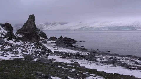 Antarctic expedition. Mountain view with snow and clouds over rocky landscape Stock-Footage 336391870