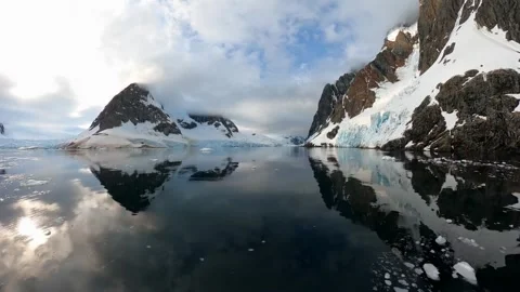 Antarctic landscape. The scene features a vast, snow-covered mountain. Stock Footage 297844783