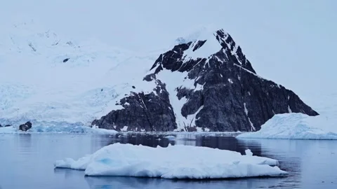 Antarctic landscape. The scene features a vast, snow-covered mountain. Stock Footage 297847828