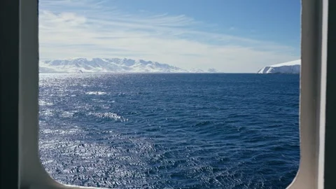 Antarctic Mountains Seen Through Ship Window on Sunny Day Stock Footage 340413917