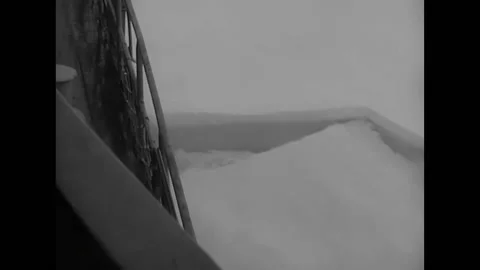 ANTARCTICA - 1945 - Large chunks of ice shatter and drift apart as the Stock Footage 316680905