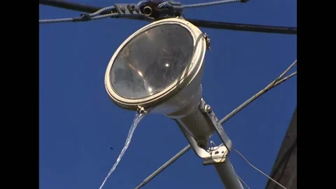ANTARCTICA - 1965 - Icicles form at the bottom of a street light in McMurdo Stock Footage 316679934