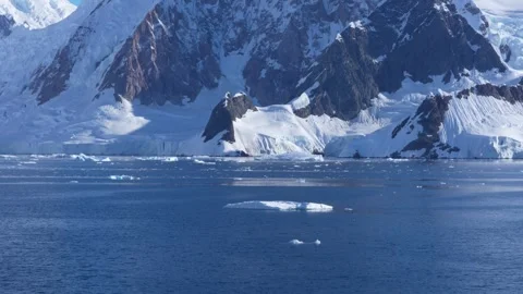Antarctica Beautiful View Of Ocean, Camera Tilts Up to Mountain. Perfect Weather Stock Footage 344463350