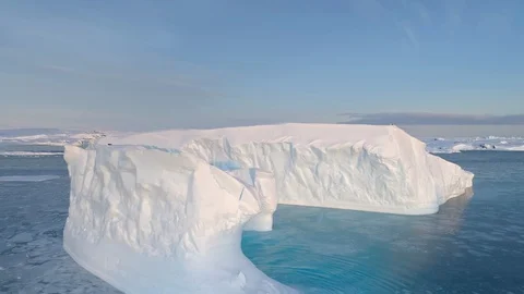 Antarctica big iceberg float aerial tracking view Stock Footage 101105198