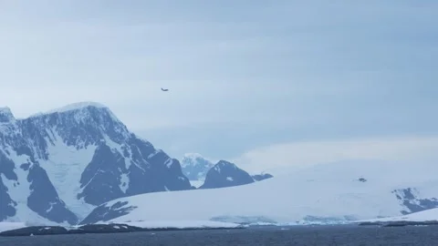 Antarctica Black Plane Flies Over Beautiful Glacier, Snow, Ice, Mountain Range.  Stock Footage 344463153