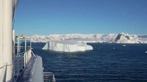 Antarctica Cruise Ship Over Side with Huge Iceberg Mountain Snow Blue Water.. Stock Footage 340304872