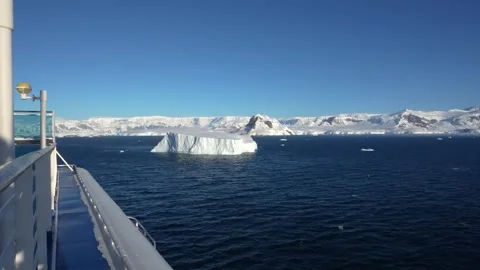 Antarctica Cruise Ship Over Side with Huge Iceberg Mountain Snow Blue Water.. Stock Footage 340305105