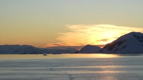 Antarctica Epic Dramatic Sunset Warm Glow Over Mountains. Sun Flare Orange .. Stock Footage 342655114