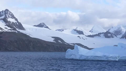 Antarctica Fast Moving Iceberg Across Screen. Stunning Landscape of Mountai.. Stock Footage 340590465