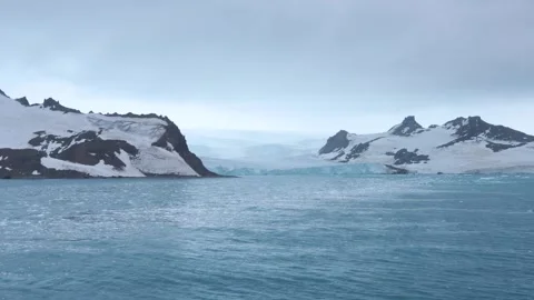 Antarctica Glacier View of Cloudy Day with Floating Ice Wide Shot Snow Cove.. Stock Footage 340303135