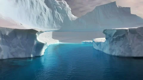 Antarctica Icebergs Drone View Floating in Deep Blue Ocean Water 4k Slow Motion Video stock 338253321