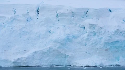 Antarctica Massive Ice Wall Sailing By Cracks and Crevasse Blue and White S.. Stock Footage 344463244