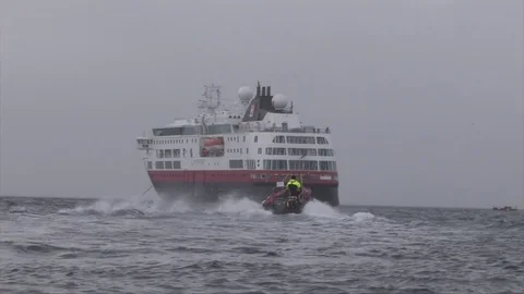 Antarctica rib heading out to MS Fram Stock Footage 73899989