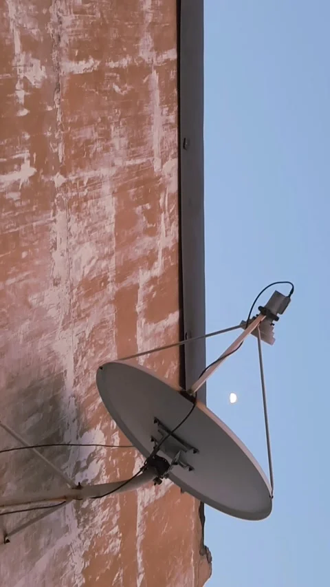 Antenna and Half Moon, A View from Rustic Wall, Vertical 4k Footage Vídeos de archivo 343407381