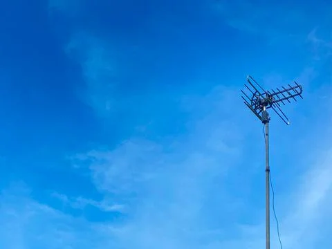 Antenna on blue sky background. Stock Photos