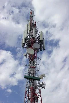 Antenna mast with white clouds in the background Stock Photos