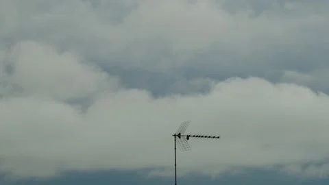 Antenna with moving clouds in background Video stock 134787215