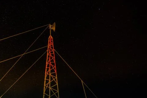 Antenna pole at night from low angle Stock Photos