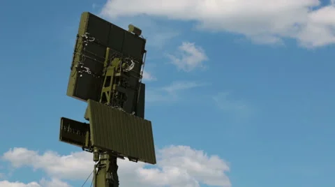 The antenna of the radar on the background of blue sky with white clouds Stock Footage 51682329