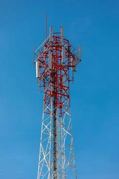 Antenna repeater tower on blue sky. Stock Photos