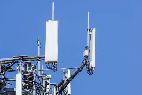 Antenna tower, with the blue sky. Close-up of the Communication antenna building Stock Photos