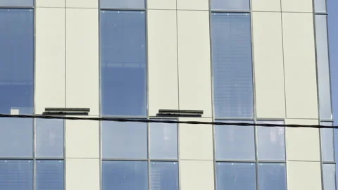 Antennas and security camera stand on a modern building roof Stock Footage 336937125