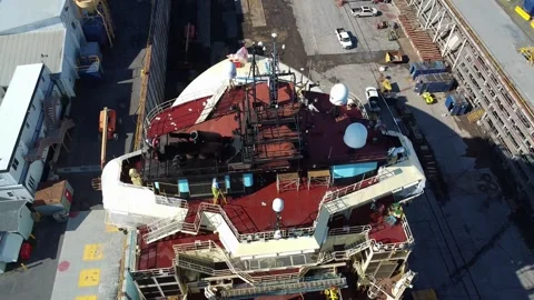 Antennas &amp; radars of a large ship in dry dock in an industrial shipyard. Stock Footage 304296851