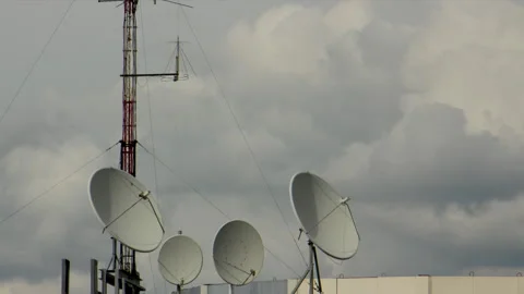 Antennas on the roof floating clouds in the background fullHD ProRes422HQ Video stock 130995875