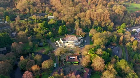 Anti-clockwise 4K 60FPS aerial view of the Floral Hall at Belfast Zoo in North Stock Footage 325846117