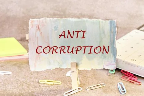 Anti corruption text written on a colored piece of paper in a clothespin Stock Photos