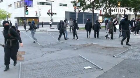 Anti-fa bringing fence to block police Stock Footage 132377428