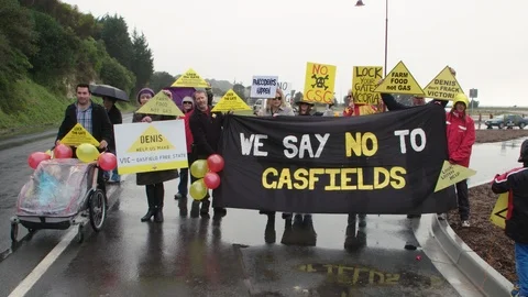 Anti-fracking protesters protesting unconventional gas exploration. Stock Footage 87645293