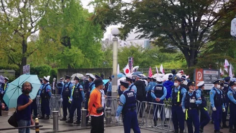 Anti Immigration Protest Held in Osaka, Police Form Barrier During Right Wing Stock Footage 319990871