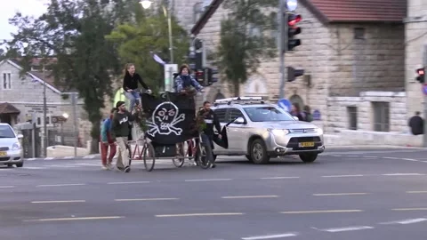 Anti judicial reform protesters in Jerusalem crossing road on bicycle Video stock 237083497