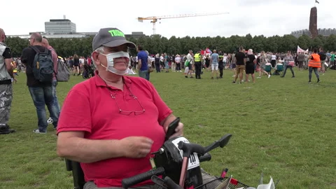 Anti lockdown protest, Covid-19 coronavirus, senior man Trump face mask 動画素材 137784173