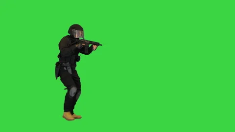 Anti terrorist unit policeman walking and aiming with a rifle on a Green Screen Stock-Footage 148445598