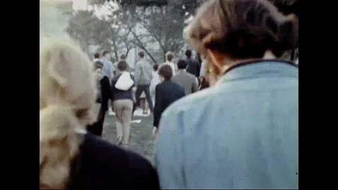 Anti-War Protesters Marching Thru Park Stock Footage 105380752