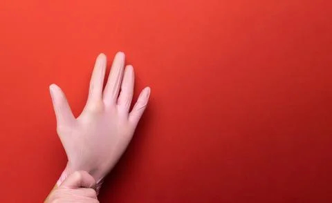 Antibacterial hand Using lab gloves on Medical red background. Cleansing hand Foto stock
