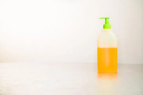 Antibacterial soap stands on a light table Stock Photos
