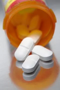 Antibiotic pills that contain 875 mg of amoxicillin and 125 mg of clavulanate Stock Photos