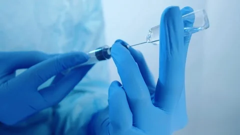 Antibiotic therapy hands gloves dosing syringe Stock Footage 125919195