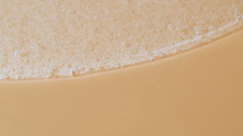 Anticeptic hand gel close-up. Liquid soap texture on orange background. Skincare Stock Footage 178622502