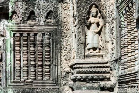 Antient reliefs of dancer, Ta Prohm Temple in Angkor Wat complex, Cambodia Stock Photos