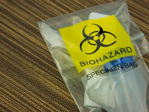 The Antigen Test Kit in biohazard garbage for medical or sci concept Stock Photos