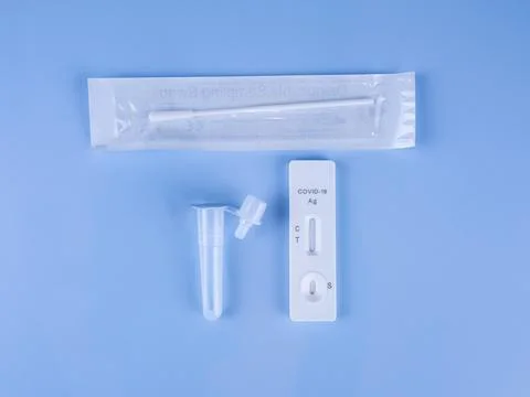 Antigen test kit for self-testing on isolated blue background. Covid-19 antig Stock Photos